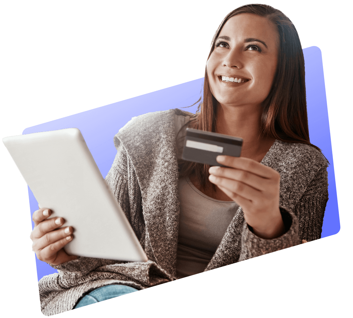 Smiling woman holding a Visa gift card and a tablet